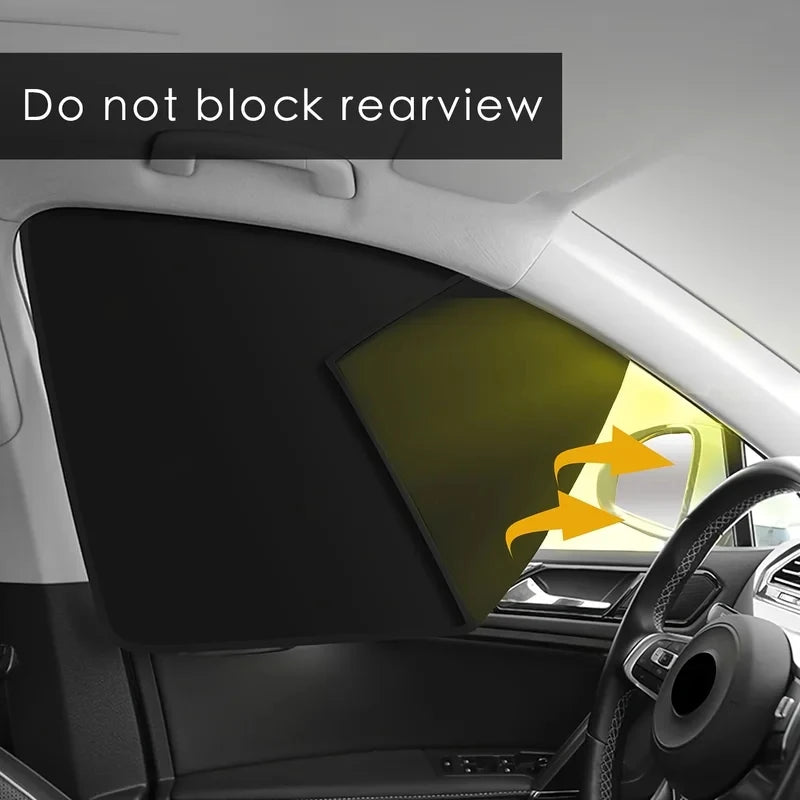 Car interior with a sunshade on the windshield, showing arrows indicating not to block rearview.