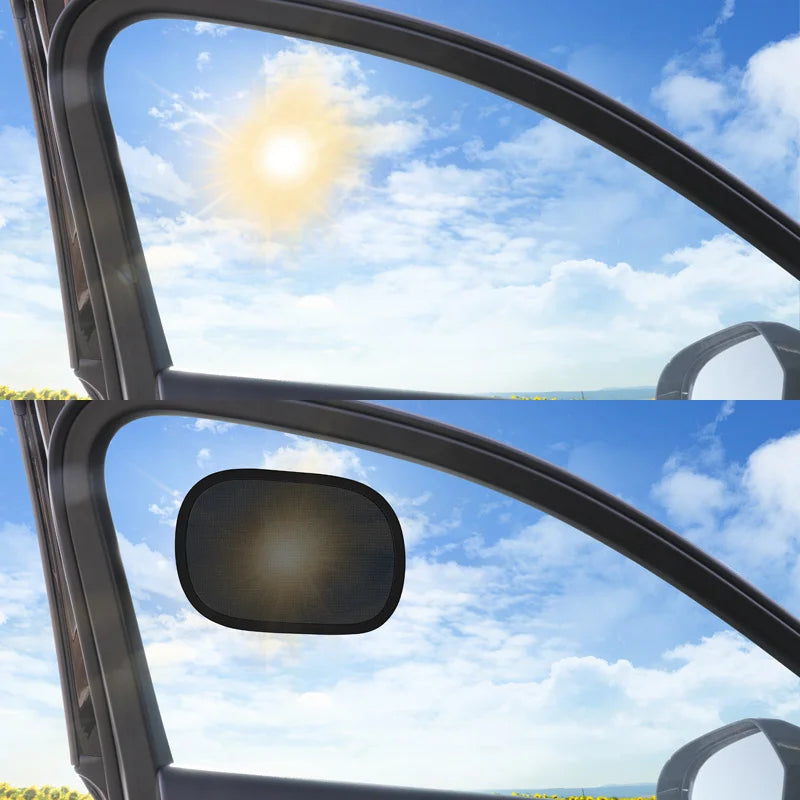 Car window with a side mirror reflecting the sky